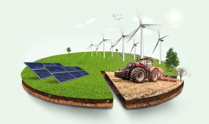 Solar panels, wind turbines and a tractor on farmland